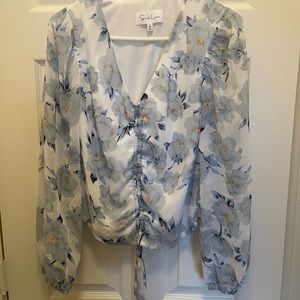 Light blue floral top. New without tags. Size small